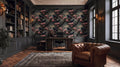 a luxurious and elegant living room with a large floral wallpaper featuring black crows. The room is furnished with a tufted leather armchair, a wooden desk, and a large window. The overall design and decor create a sophisticated and sophisticated atmosphere.