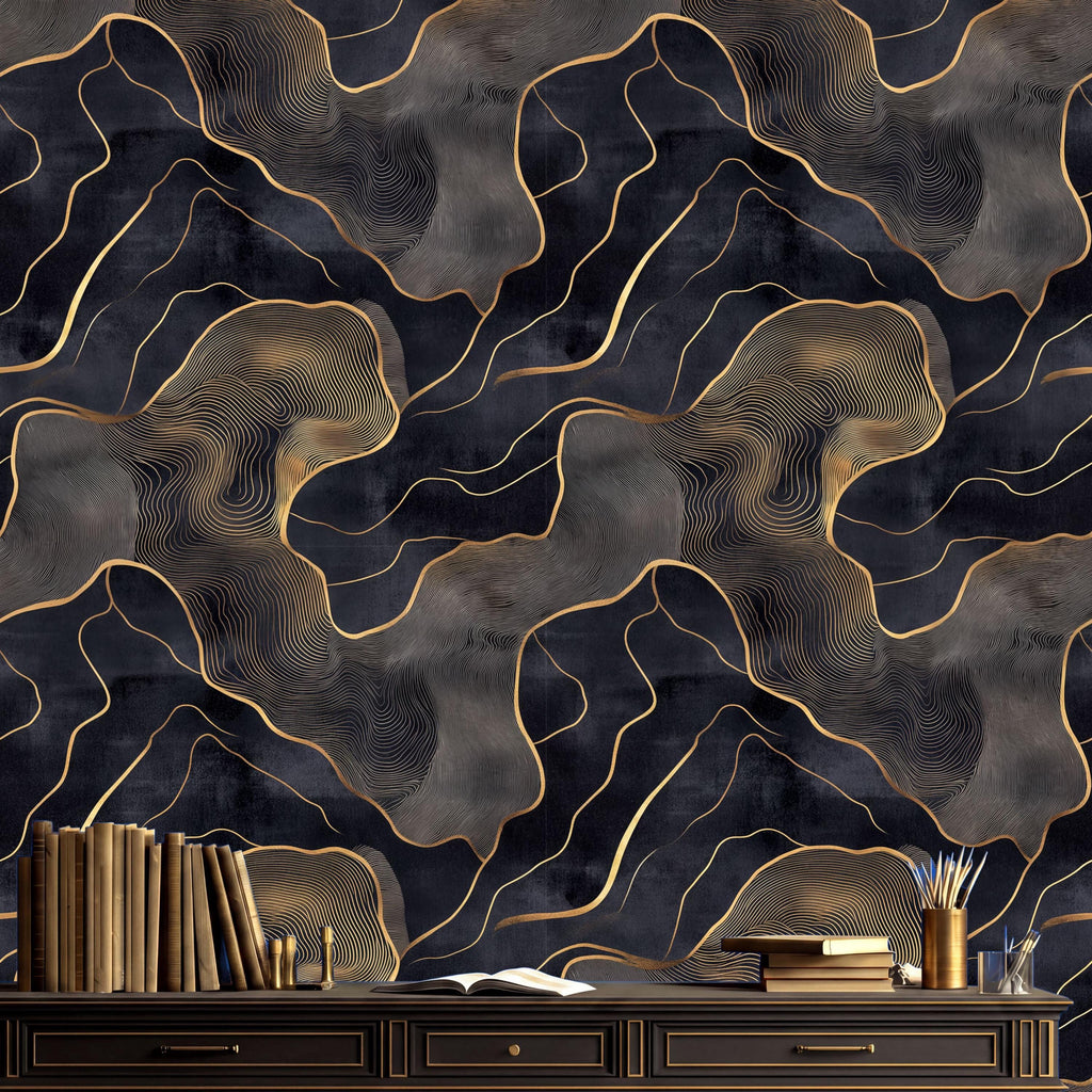 a dark, abstract wallpaper with a gold and black marble-like pattern. In front of the wallpaper, there is a wooden desk with a bookshelf and a vase on it. The bookshelf contains several books, and the vase is filled with pens and pencils.