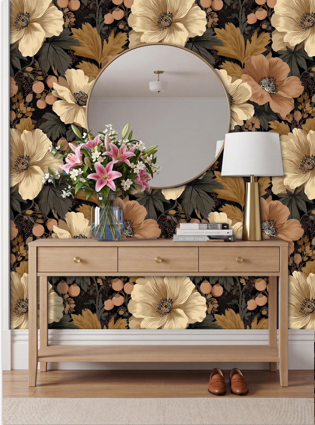 a wooden console table with a round mirror above it, set against a wall with a floral wallpaper. The table has a vase of flowers and a lamp on it, creating a cozy and inviting atmosphere.