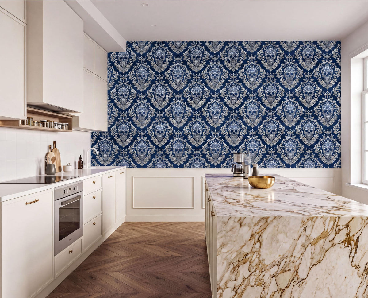 a modern kitchen with a marble countertop, white cabinets, and a large blue and white damask wallpaper on the wall.