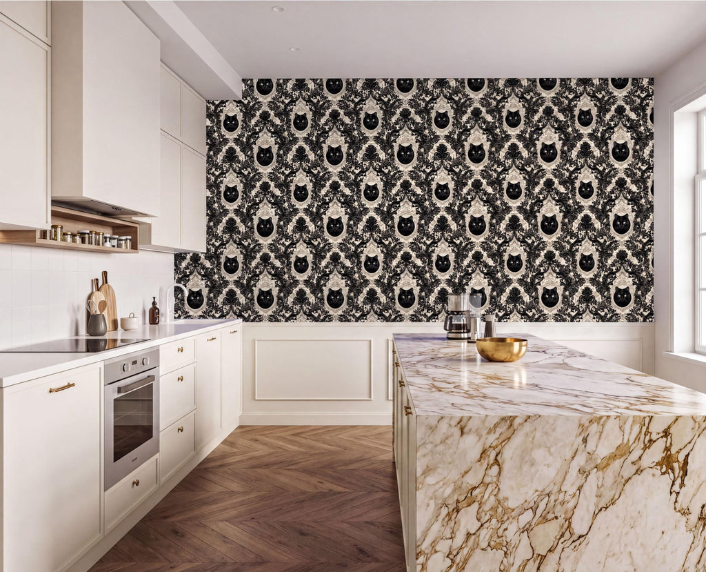 a modern kitchen with a marble countertop and a black and white damask wallpaper featuring a repeating pattern of cat faces. The kitchen is well-equipped with white cabinets and a stainless steel oven.