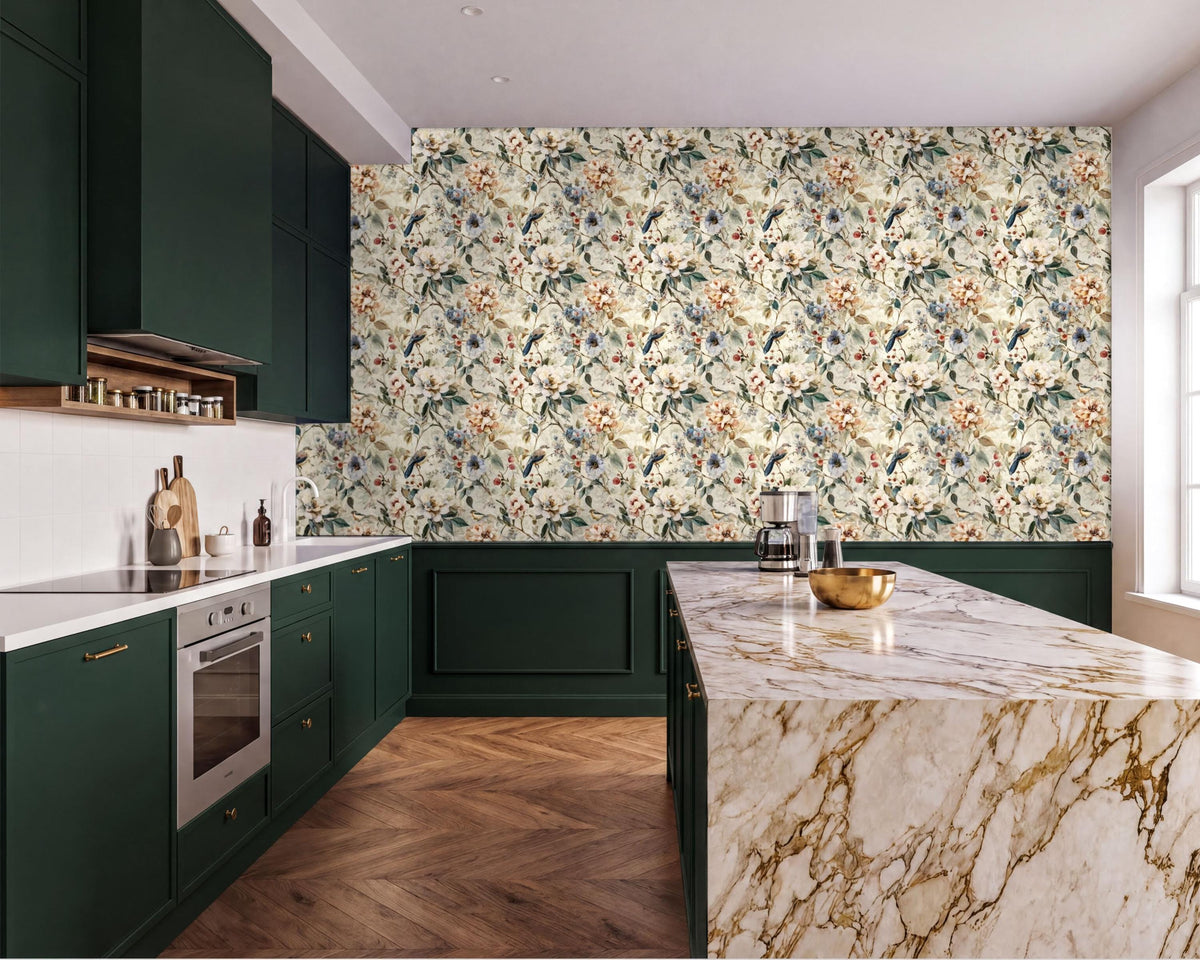 a modern kitchen with a marble countertop, dark green cabinets, and a floral wallpaper accent wall.