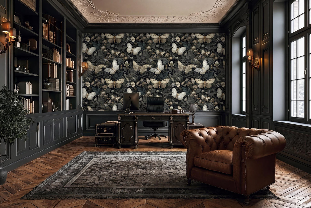 a luxurious and elegant living room with a large, dark-colored bookshelf filled with books, a large wall mural featuring a repeating pattern of butterflies, a wooden desk with a chair, and a tufted leather armchair.