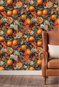 a vibrant orange and white floral wallpaper with a repeating pattern of oranges and white flowers. The wallpaper is set against a brown leather armchair, creating a warm and inviting atmosphere.