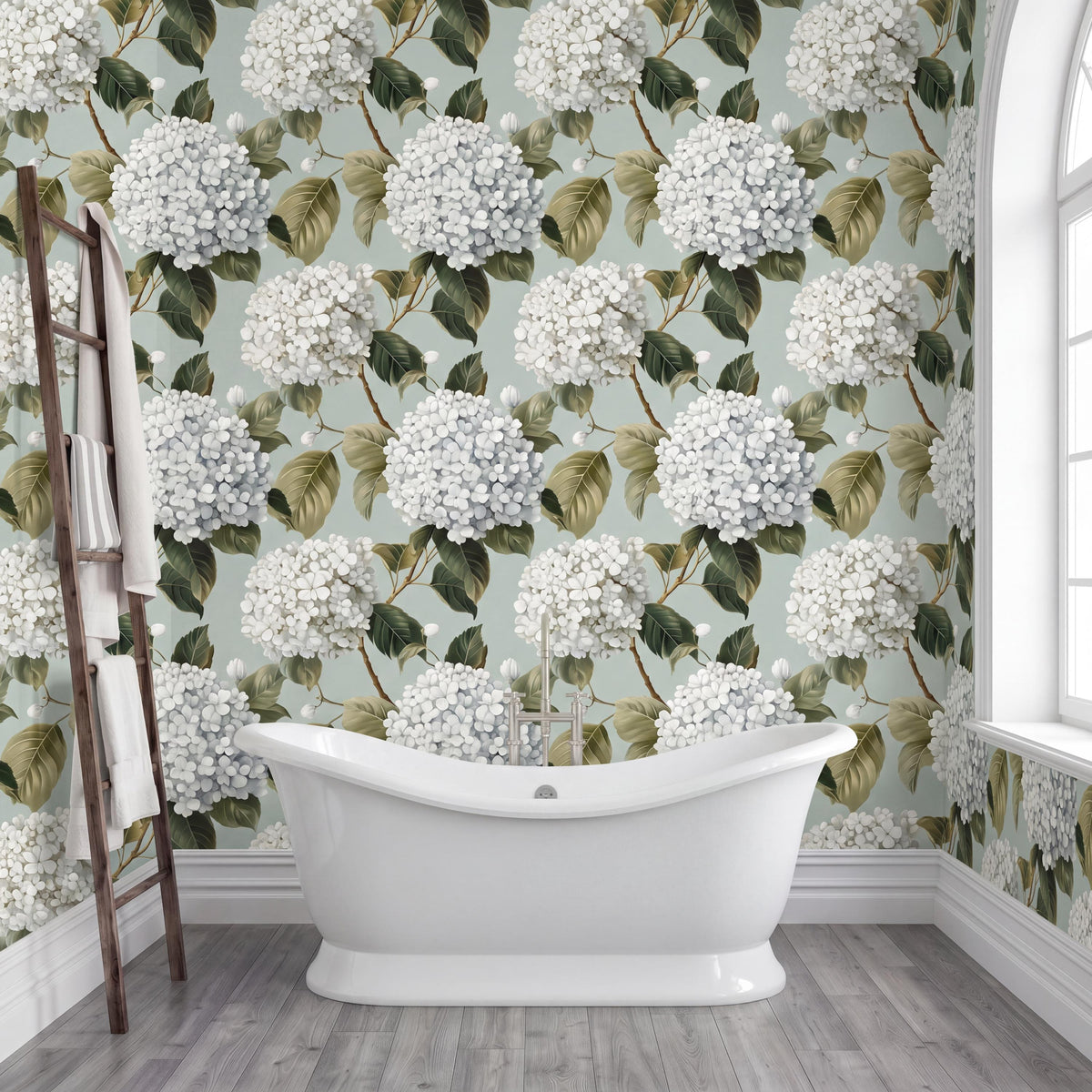 a bathroom with a white clawfoot bathtub in the center, surrounded by a floral wallpaper with white hydrangeas and green leaves. A wooden ladder is leaning against the wall next to the bathtub.