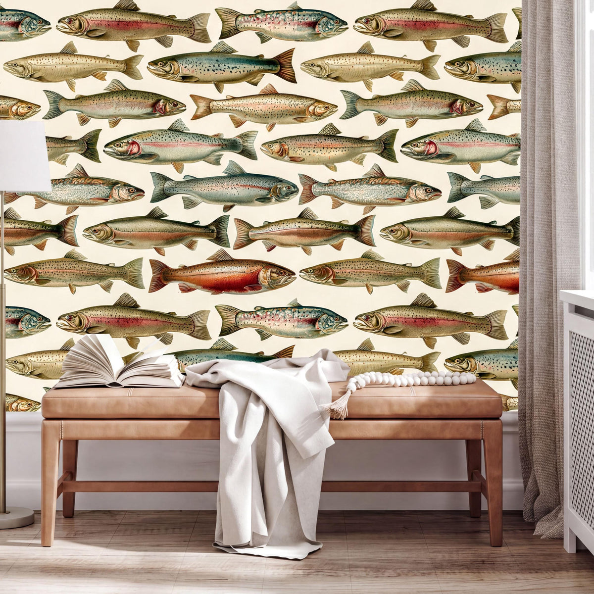 a wallpapered wall with a repeating pattern of fish illustrations, including salmon, trout, and other types of fish. In front of the wall, there is a wooden bench with an open book and a white blanket on it.