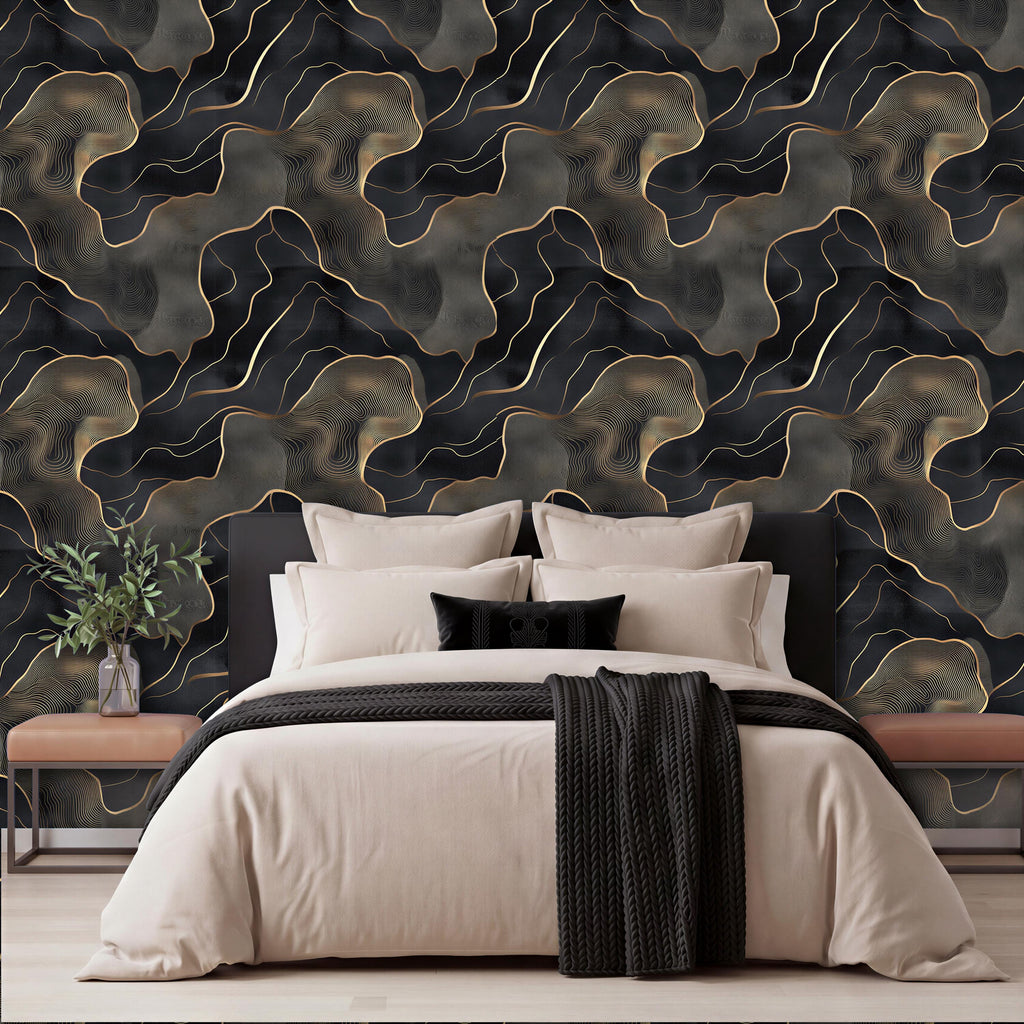 a modern bedroom with a large bed, dark and light-colored bedding, and a black and gold abstract wallpaper behind it.