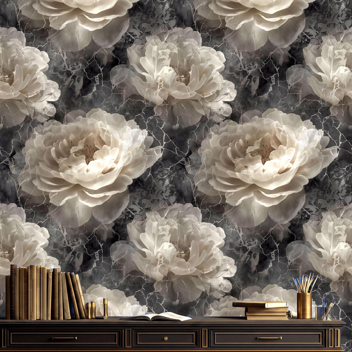 a dark gray marble wall with a large floral pattern of white and beige flowers. On a wooden dresser in the foreground, there are several books and a cup.