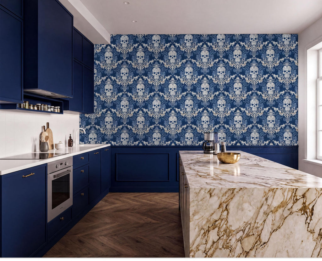 a modern kitchen with a striking blue and white color scheme. The kitchen features dark blue cabinets, a marble countertop, and a patterned wallpaper with white skull designs. The kitchen is well-equipped with a stove, oven, and sink, and there are various kitchen accessories and utensils visible.