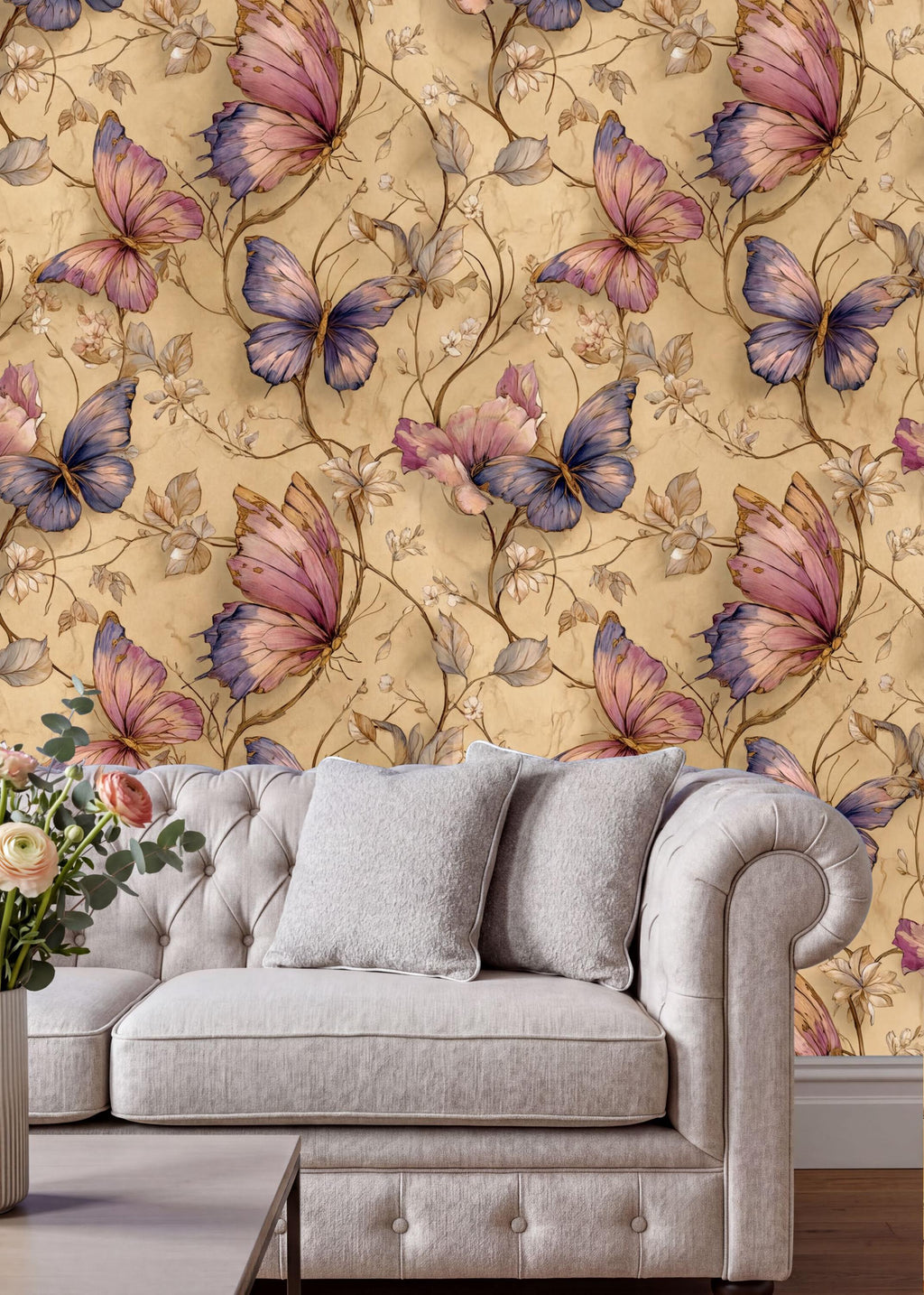 a cozy living room with a white tufted sofa and a vase of flowers on a coffee table. The walls behind the sofa are adorned with a vibrant floral wallpaper pattern, predominantly featuring pink and purple butterflies. The overall scene creates a warm and inviting atmosphere.
