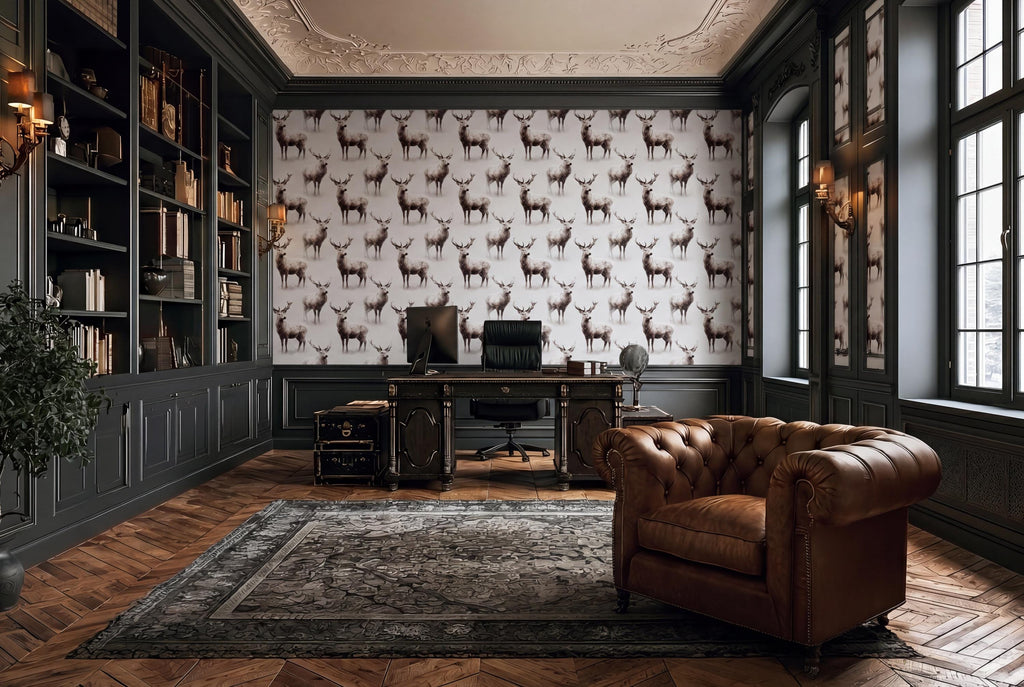 a luxurious and well-appointed home office with a large wallpapered wall featuring a repeating pattern of deer. The room is furnished with a leather armchair, a wooden desk, and a large rug on the floor. The space is illuminated by natural light coming through the windows, creating a warm and inviting atmosphere.