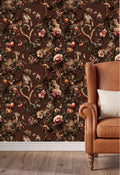 a wallpapered wall with a floral pattern of leopards, flowers, and leaves, creating a vibrant and lively atmosphere. In the foreground, there is a brown leather armchair with a white pillow, providing a cozy and inviting seating area.