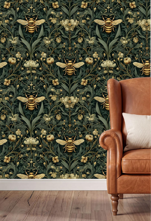 a wallpapered wall with a repeating pattern of bees and flowers in shades of green and gold. In the foreground, there is a brown leather armchair with a white pillow on it.