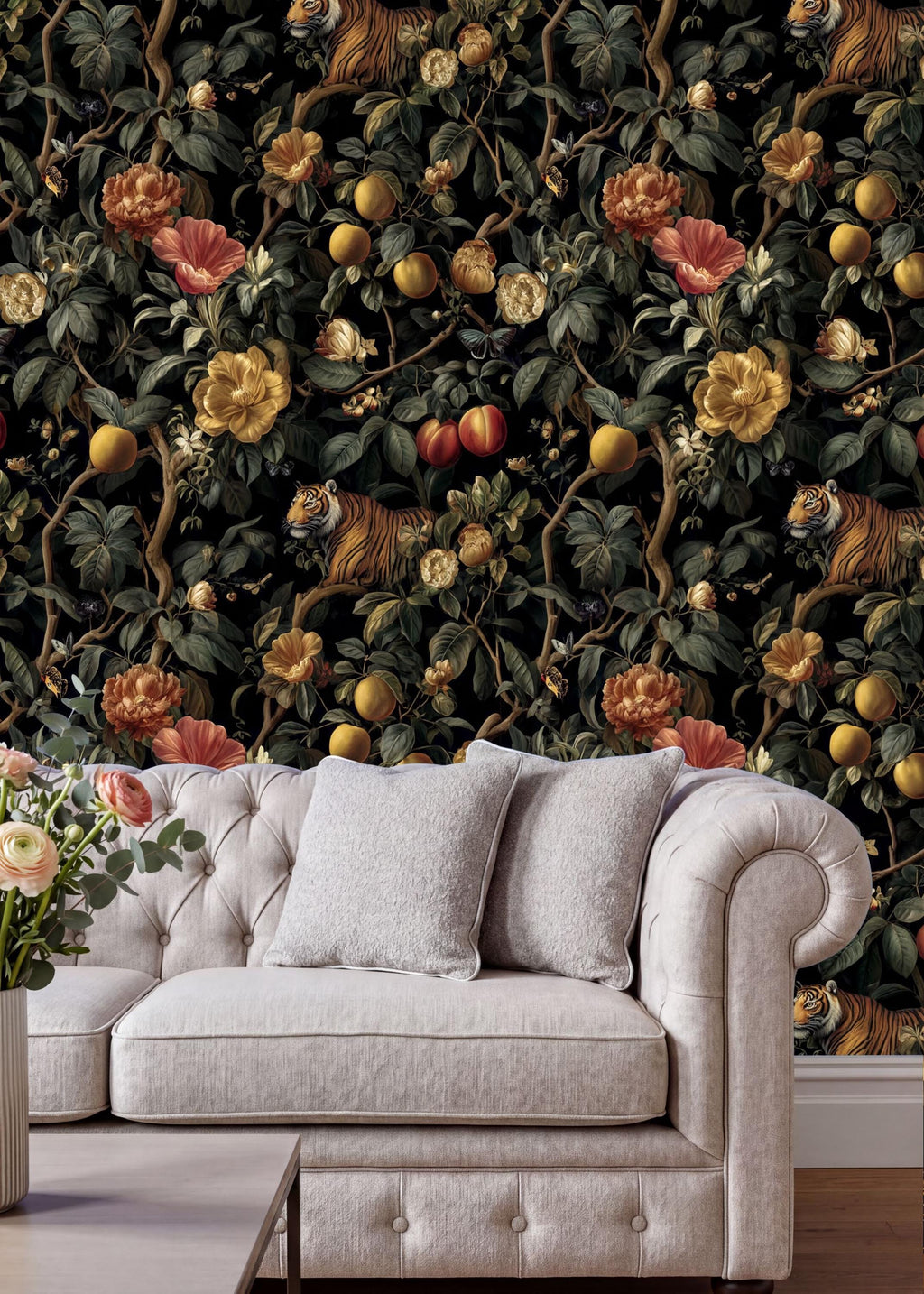 a white tufted sofa with two gray pillows, positioned in front of a vibrant, detailed wallpaper with a lush, colorful jungle scene.