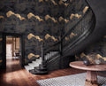 a grand staircase with a black railing and ornate wooden steps, leading up to a round wooden table with a black vase on top. The walls are covered in a dark, abstract wallpaper with gold accents, creating a striking and luxurious atmosphere.