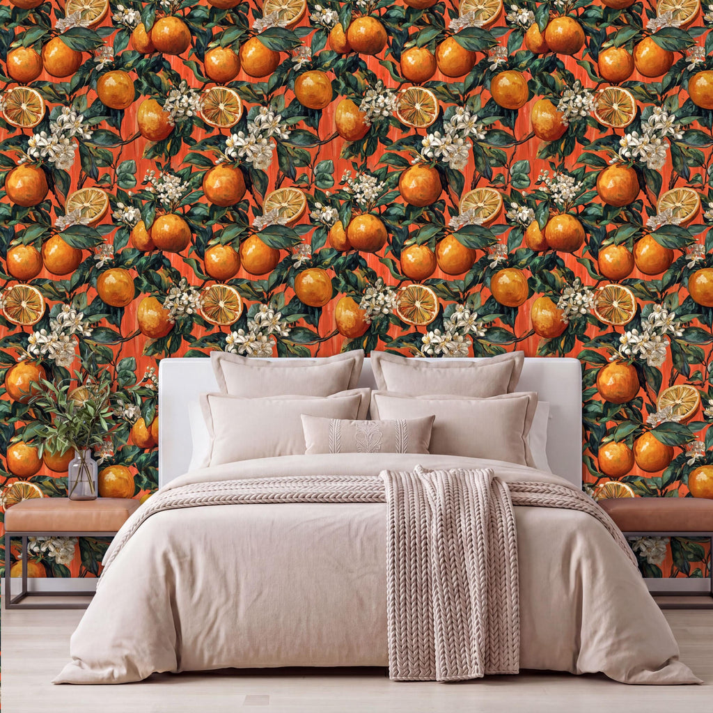 a bedroom with a large orange and white floral wallpaper behind the bed. The bed is covered with a white comforter and has several pillows. There is a wooden nightstand on the left side of the bed, and a vase of flowers is placed on the nightstand.