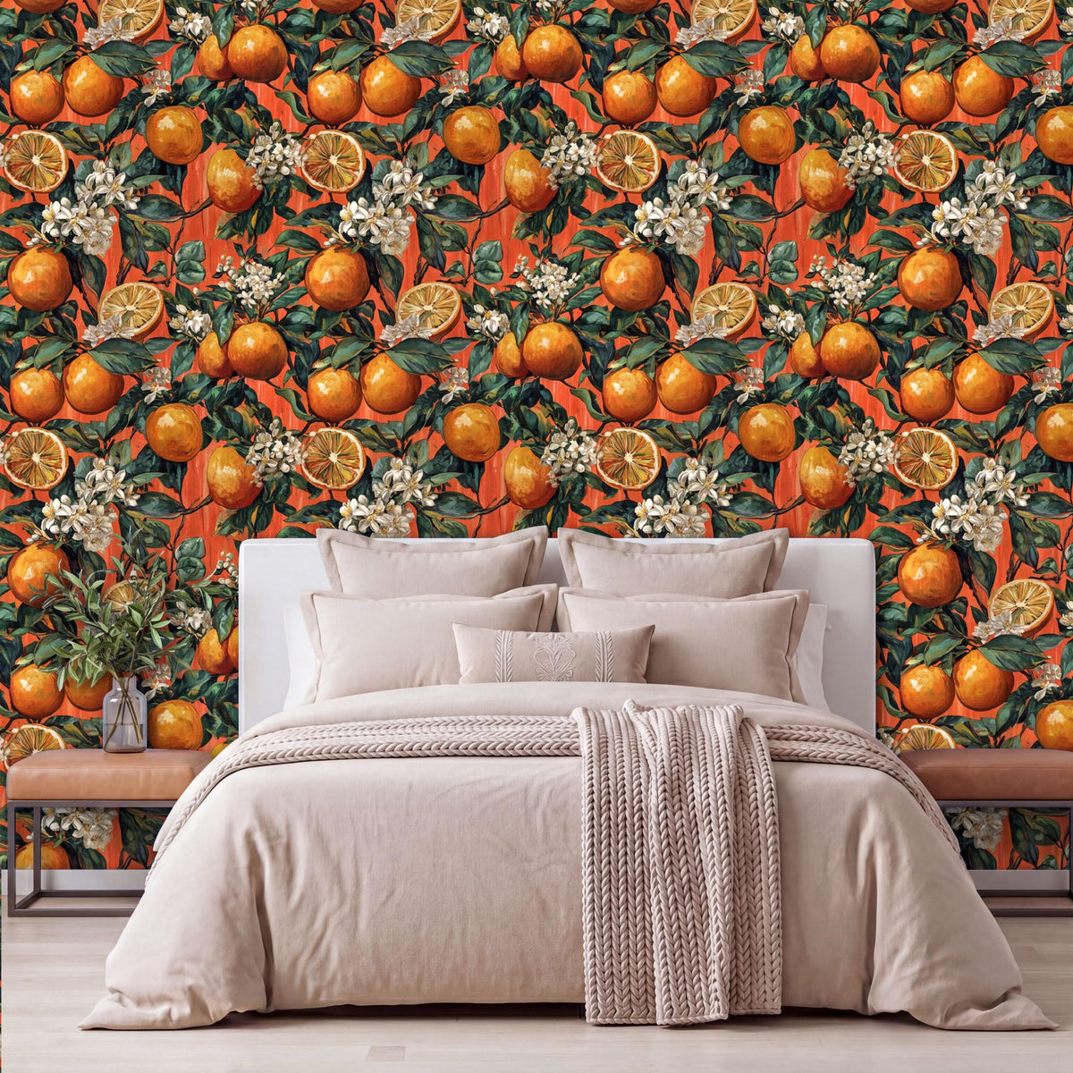 a bedroom with a large orange and white floral wallpaper behind the bed. The bed is covered with a white comforter and has several pillows. There is a wooden nightstand on the left side of the bed, and a vase of flowers is placed on the nightstand.