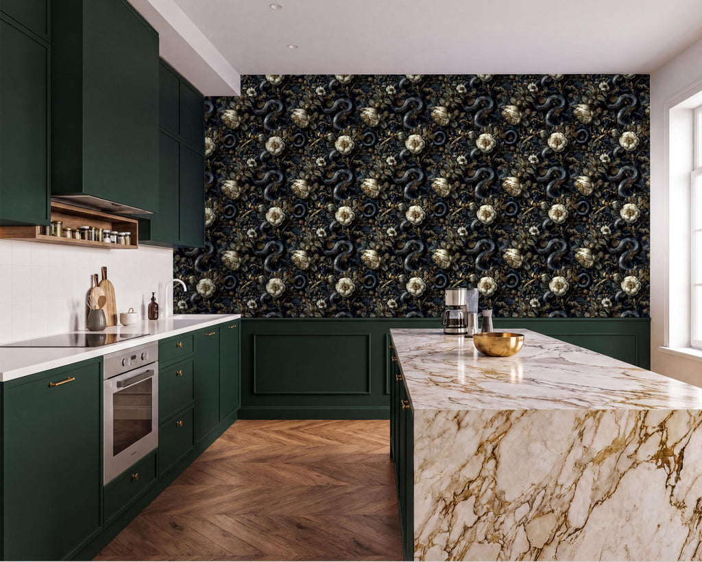 a modern kitchen with a marble countertop and dark green cabinets. The walls are covered in a floral pattern wallpaper, and the floor is made of wood. The kitchen features a large island with a marble countertop and a gold bowl on it.