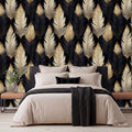 a modern bedroom with a large bed, dark headboard, and a wallpapered wall with a repeating pattern of black and gold feathers.