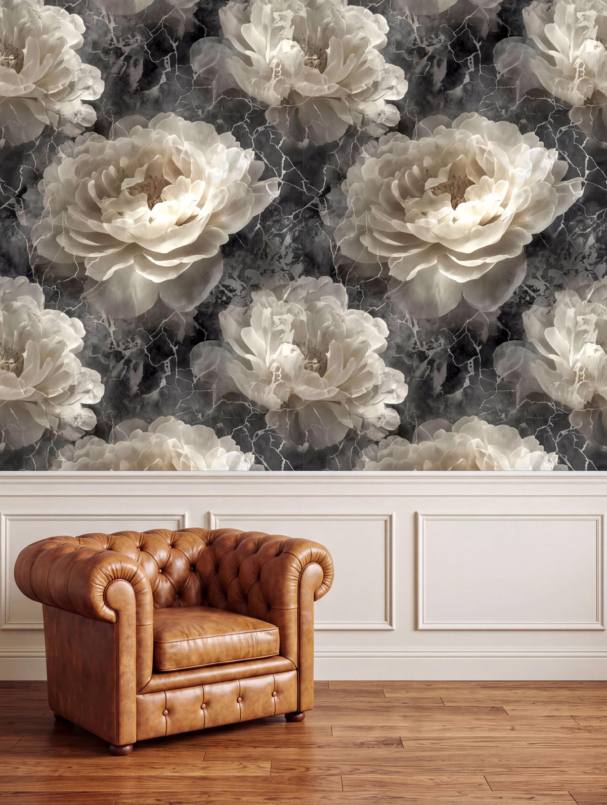 a brown leather armchair positioned in front of a wall with a large floral wallpaper.