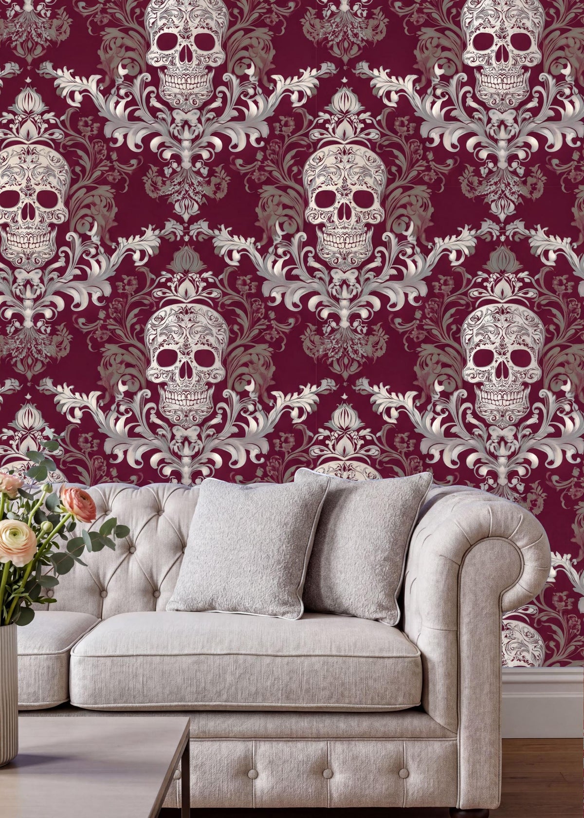 a living room with a white tufted sofa and a coffee table. The sofa is positioned against a wall with a repeating pattern of skull designs in shades of red and white, creating a striking and bold visual effect. The coffee table is placed in front of the sofa, adding to the room's cozy and inviting atmosphere.