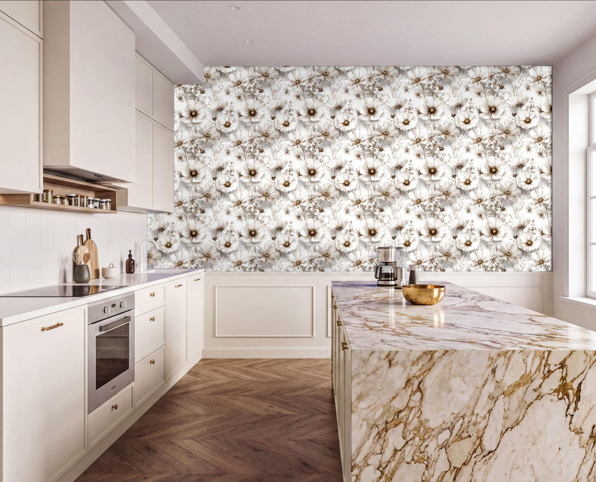 a modern kitchen with a marble countertop and a large floral wallpaper behind it. The kitchen features white cabinets, a stainless steel oven, and a marble island with a bowl on it.