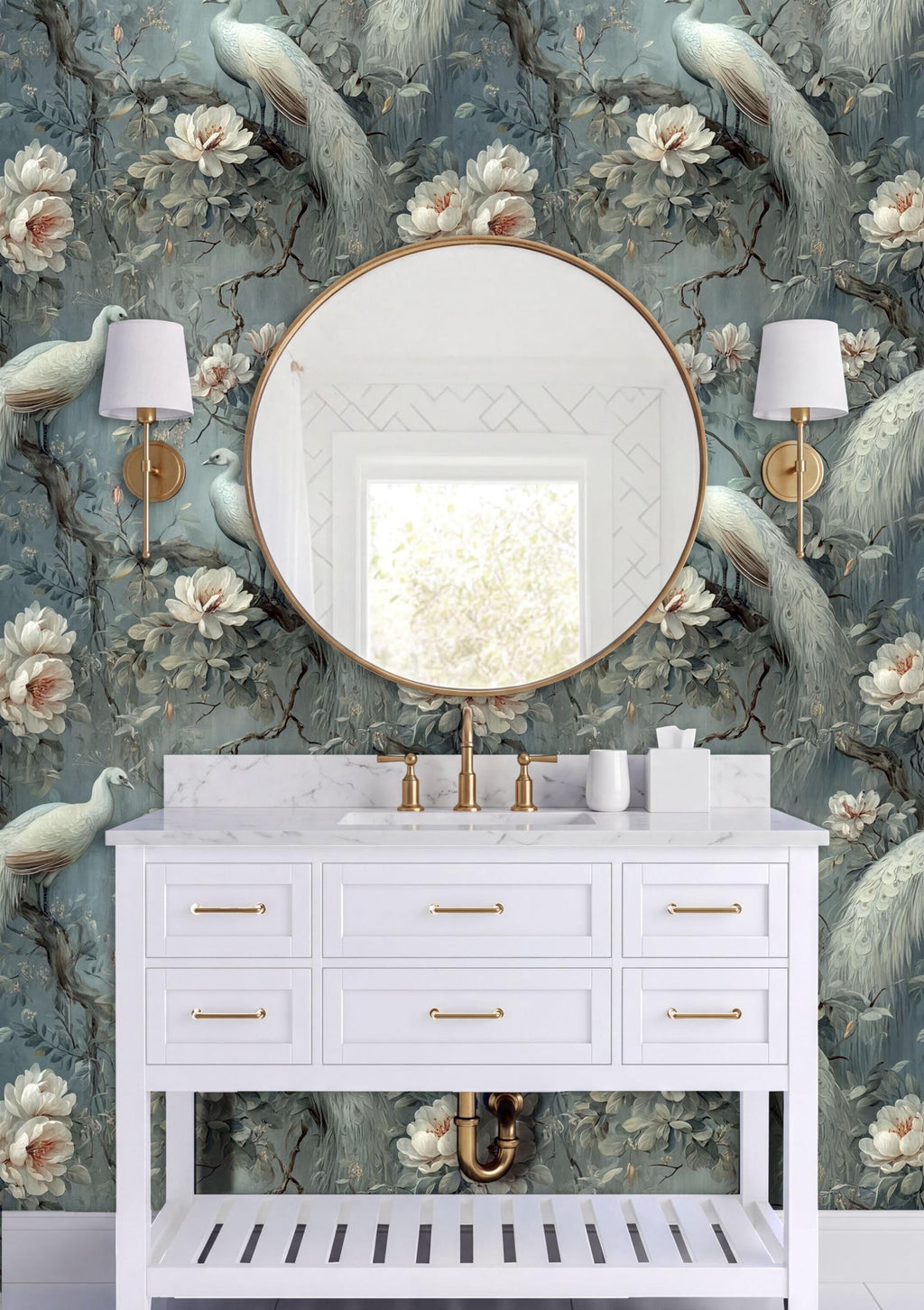 a bathroom vanity with a white countertop, a round mirror, and two wall sconces. The wall behind the vanity has a floral wallpaper with peacocks and flowers.