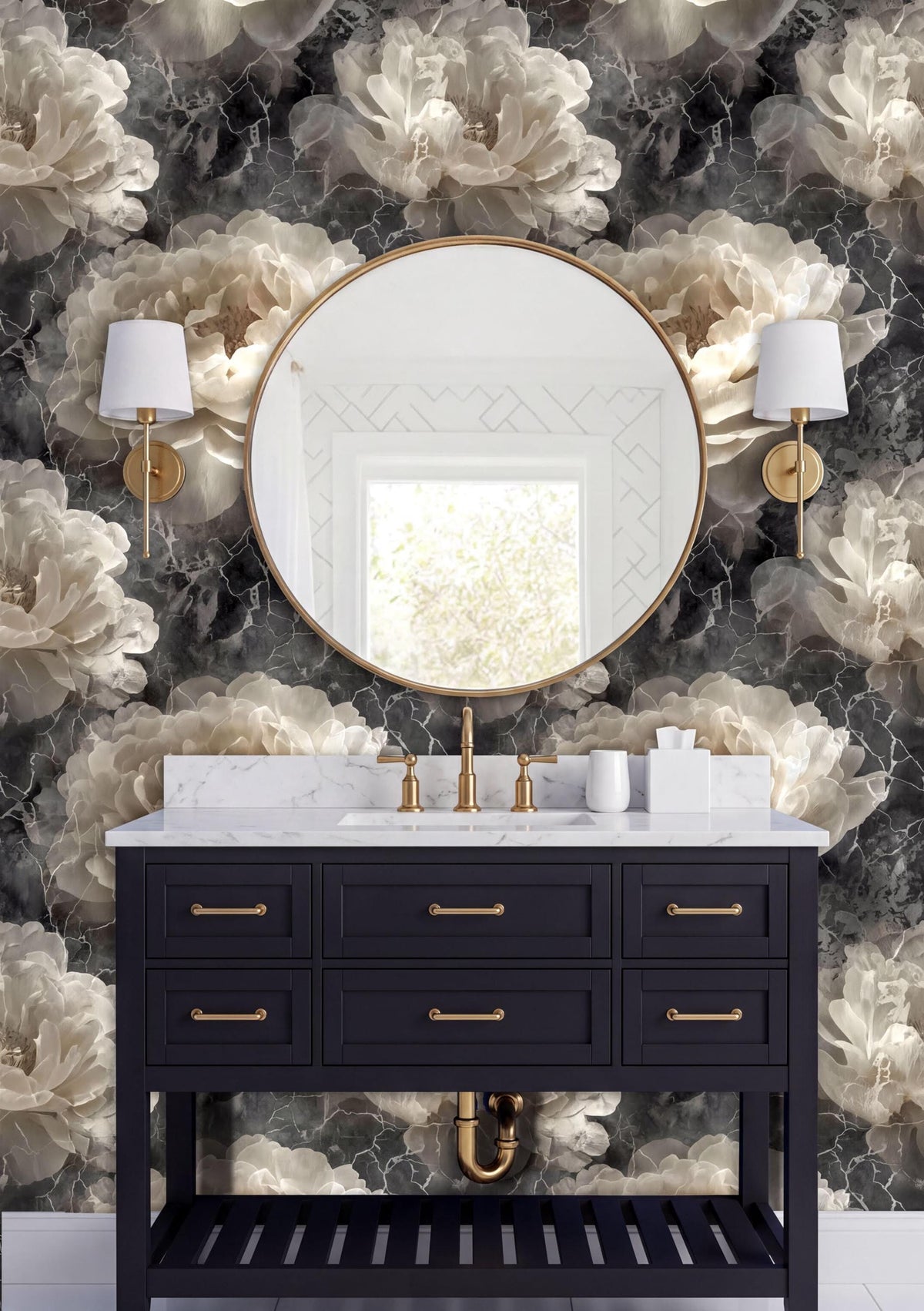 a bathroom vanity with a black cabinet, a round mirror, and two white wall sconces. The vanity has a white marble countertop and gold fixtures. The wall behind the vanity is covered in a floral wallpaper with a black and white color scheme.