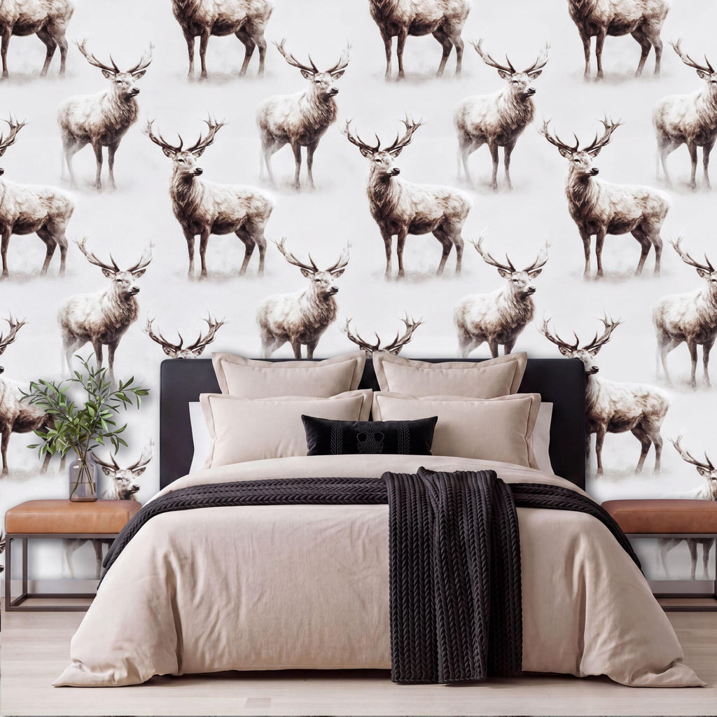 a bedroom with a large bed and a wallpapered wall with a repeating pattern of deer.