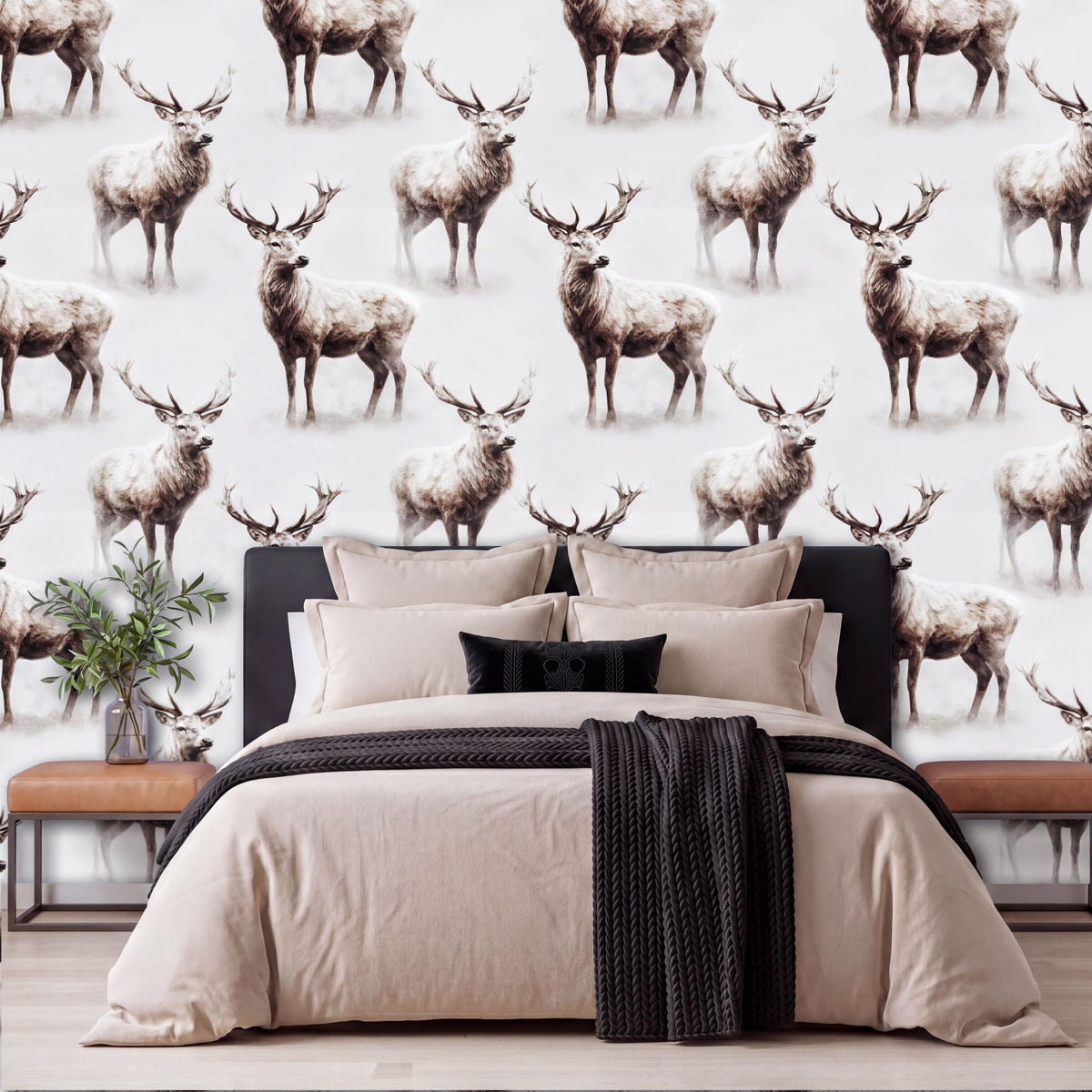 a bedroom with a large bed and a wallpapered wall with a repeating pattern of deer.