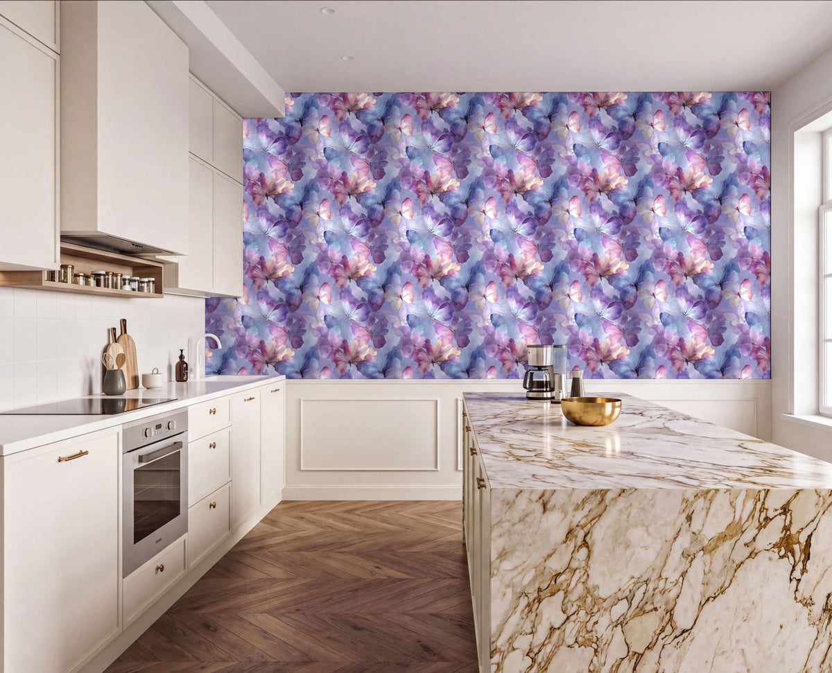 a modern kitchen with a marble countertop and a large, colorful wallpaper featuring a floral pattern in shades of purple, pink, and blue. The kitchen is well-equipped with white cabinets and a stainless steel oven, and there are various kitchen accessories and appliances visible, such as a coffee maker and a bowl.