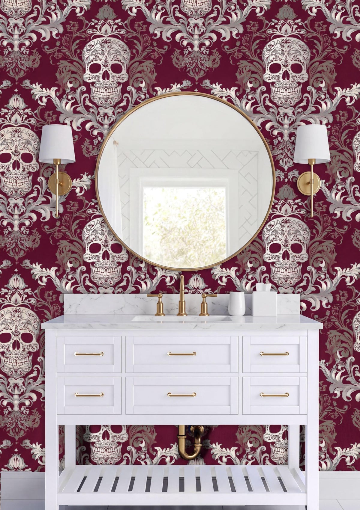 a bathroom with a white vanity and a round mirror above it. The walls are covered in a burgundy and white skull wallpaper, creating a bold and dramatic design. There are two white lamps on either side of the mirror, providing illumination to the space. The overall color scheme and layout of the bathroom give it a unique and striking appearance.