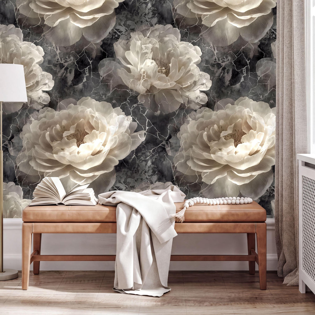 a large floral wallpaper with white and gray tones, creating a serene and elegant atmosphere. In the foreground, there is a wooden bench with an open book and a white blanket draped over it. The overall scene suggests a cozy and inviting space, possibly a living room or a bedroom.