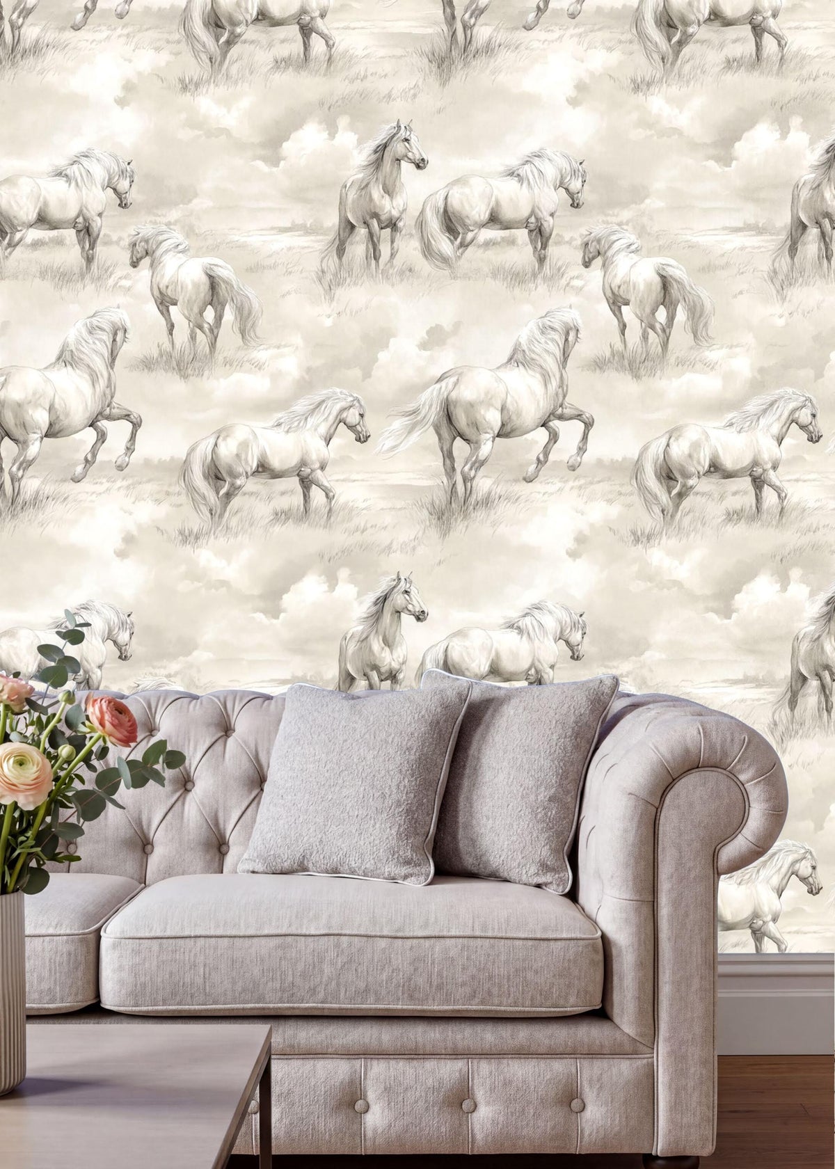 a living room with a gray sofa and a vase of flowers on a table. The wall behind the sofa is covered in a repeating pattern of horses in a field, creating a serene and pastoral atmosphere.