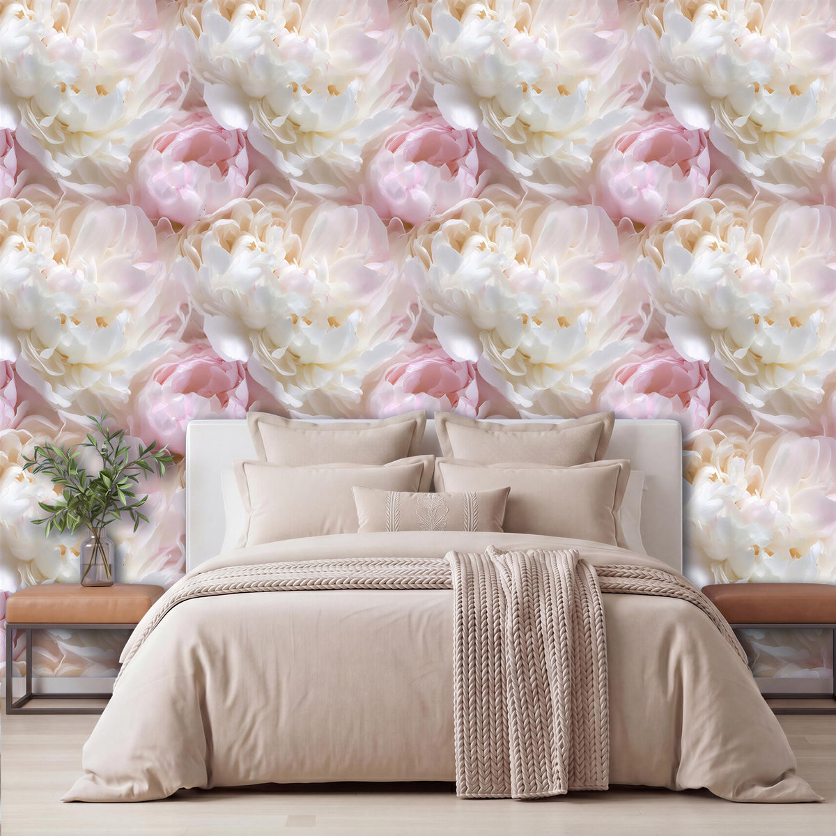 a bedroom with a large bed, a wooden nightstand, and a vase of flowers on the nightstand. The wall behind the bed is covered in a repeating pattern of pink and white flowers, creating a visually appealing and cozy atmosphere.