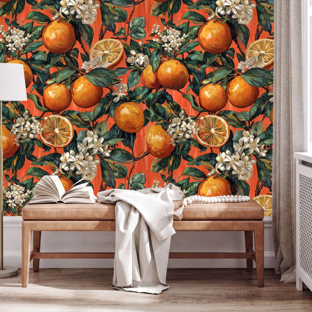a vibrant orange and white floral wallpaper with illustrations of oranges and white flowers, creating a warm and inviting atmosphere. In the foreground, there is a wooden bench with an open book and a white blanket draped over it.