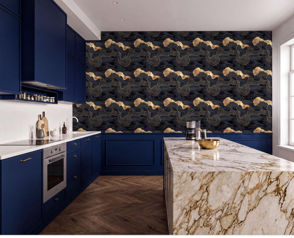 The image showcases a modern kitchen with a marble countertop and dark blue cabinets. The countertop has a marble-like texture and is adorned with a gold bowl and a silver pitcher. The walls are covered in a black and gold wallpaper pattern, and the floor is made of wood. The kitchen is well-equipped with a stove, oven, and sink, and there are several bottles and a bowl on the countertop.