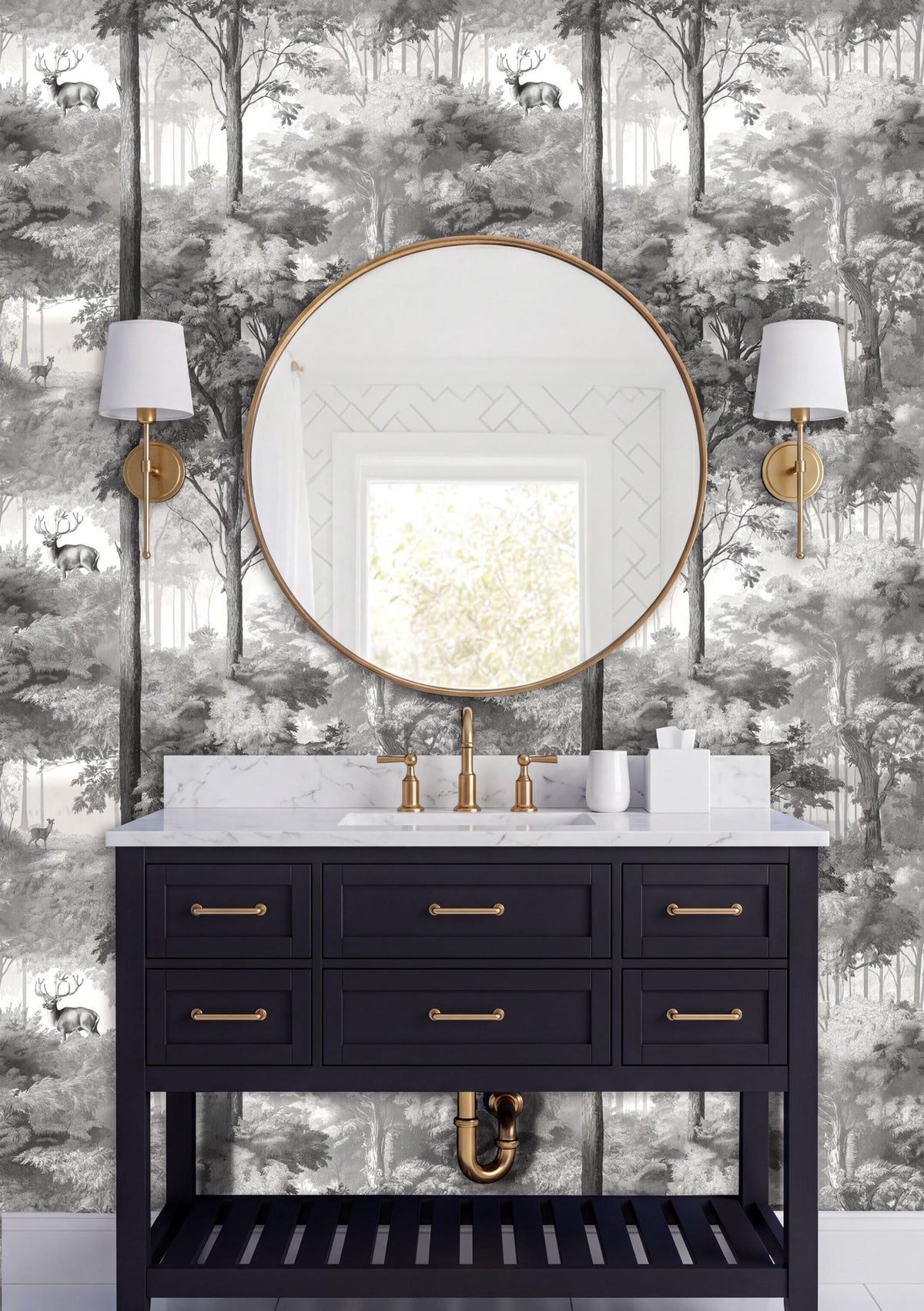 a bathroom vanity with a black cabinet, a round mirror, and two wall sconces. The vanity has a white countertop and is set against a wall with a black and white wallpaper pattern depicting a forest scene.