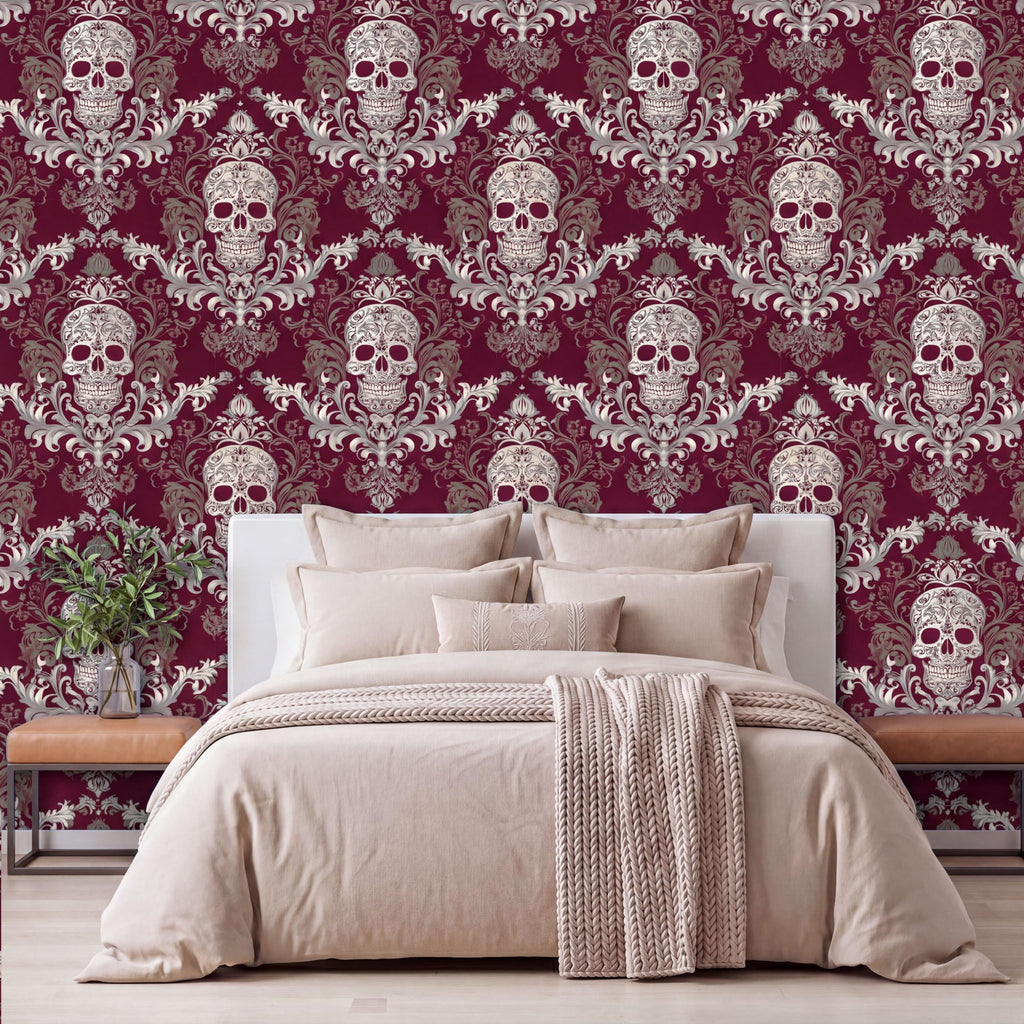 a bedroom with a large bed, a wooden nightstand, and a wallpapered wall with a repeating pattern of skulls and floral designs in shades of burgundy and white.