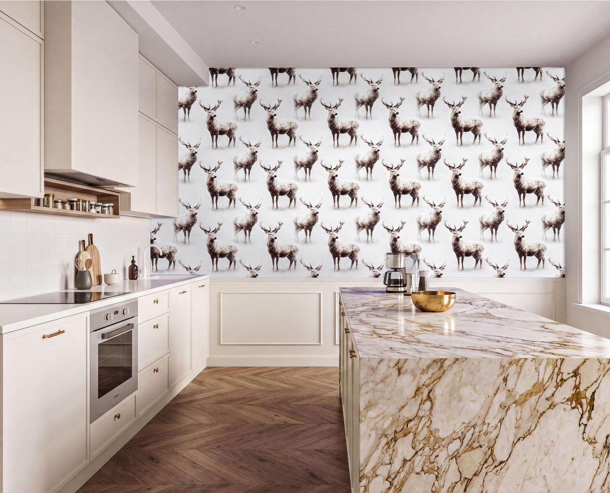 a modern kitchen with a large wallpapered wall displaying a repeating pattern of deer. The kitchen has white cabinets, a marble countertop, and a stainless steel oven.