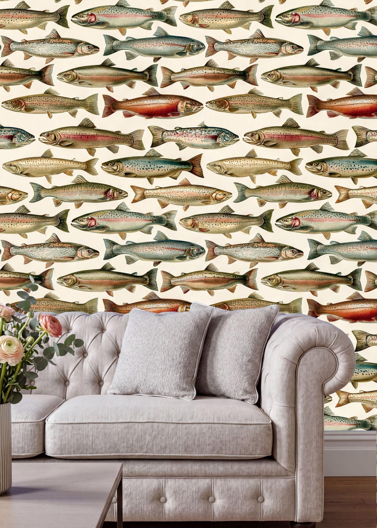 a living room with a white tufted sofa and a coffee table. The wall behind the sofa is covered in a repeating pattern of colorful fish illustrations, creating a vibrant and lively atmosphere.