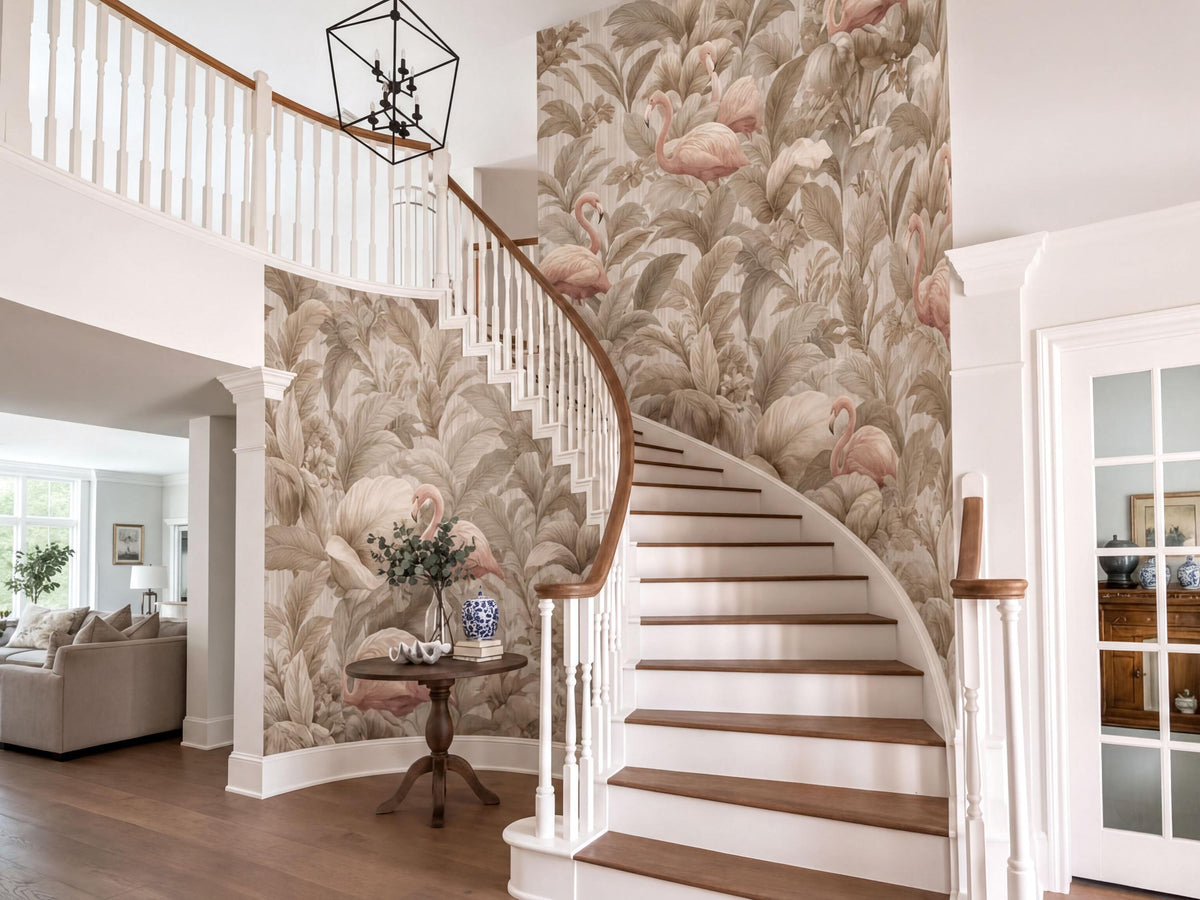 a well-decorated entryway with a spiral staircase, a wooden table with a vase of flowers, and a chandelier hanging above. The walls feature a floral wallpaper with pink flamingos, and the overall color scheme is neutral, with white and beige tones.