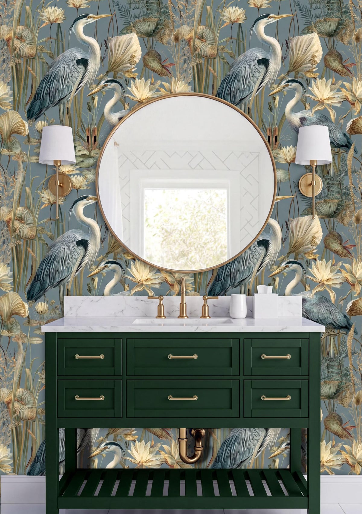 a bathroom vanity with a green cabinet and a round mirror above it. The wall behind the vanity has a floral wallpaper with a repeating pattern of blue and white birds and flowers. There are two white lamps on either side of the mirror, and the overall color scheme of the bathroom is predominantly green and blue.