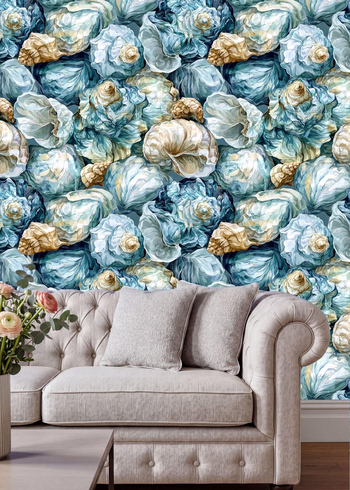 a large wallpapered wall with a repeating pattern of blue and white seashells and a white tufted sofa in the foreground.