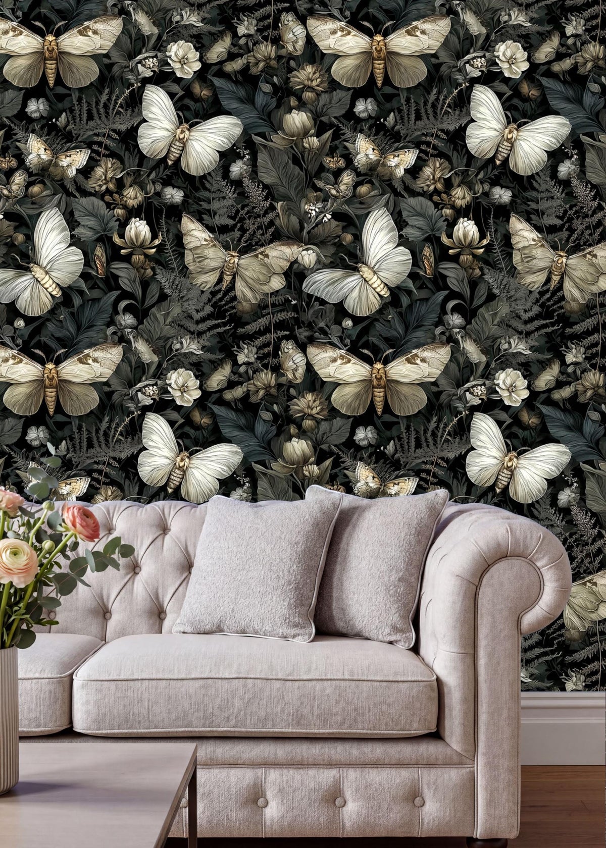 a living room with a white tufted sofa and a vase of flowers on a coffee table. The wall behind the sofa is covered in a wallpaper with a repeating pattern of white butterflies and green foliage.
