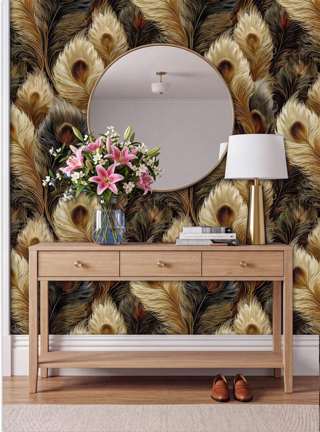 a wooden console table with a round mirror above it, a vase of pink flowers, a lamp, and a pair of brown shoes placed on the floor in front of the table.