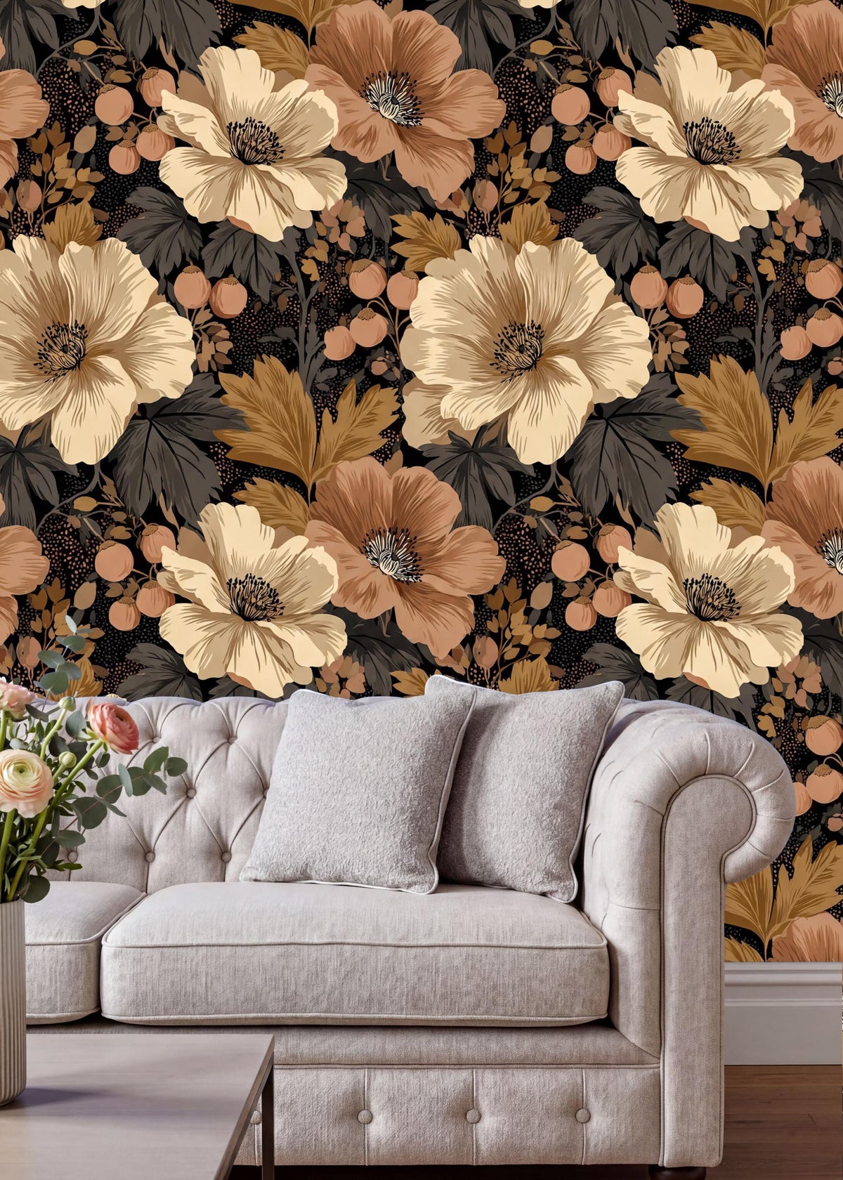 a cozy living room setting with a white tufted sofa and a wooden coffee table. The sofa is positioned against a wall with a vibrant floral wallpaper, which includes a variety of flowers in shades of orange, yellow, and white. The arrangement of the furniture and the floral wallpaper creates a warm and inviting atmosphere in the room.
