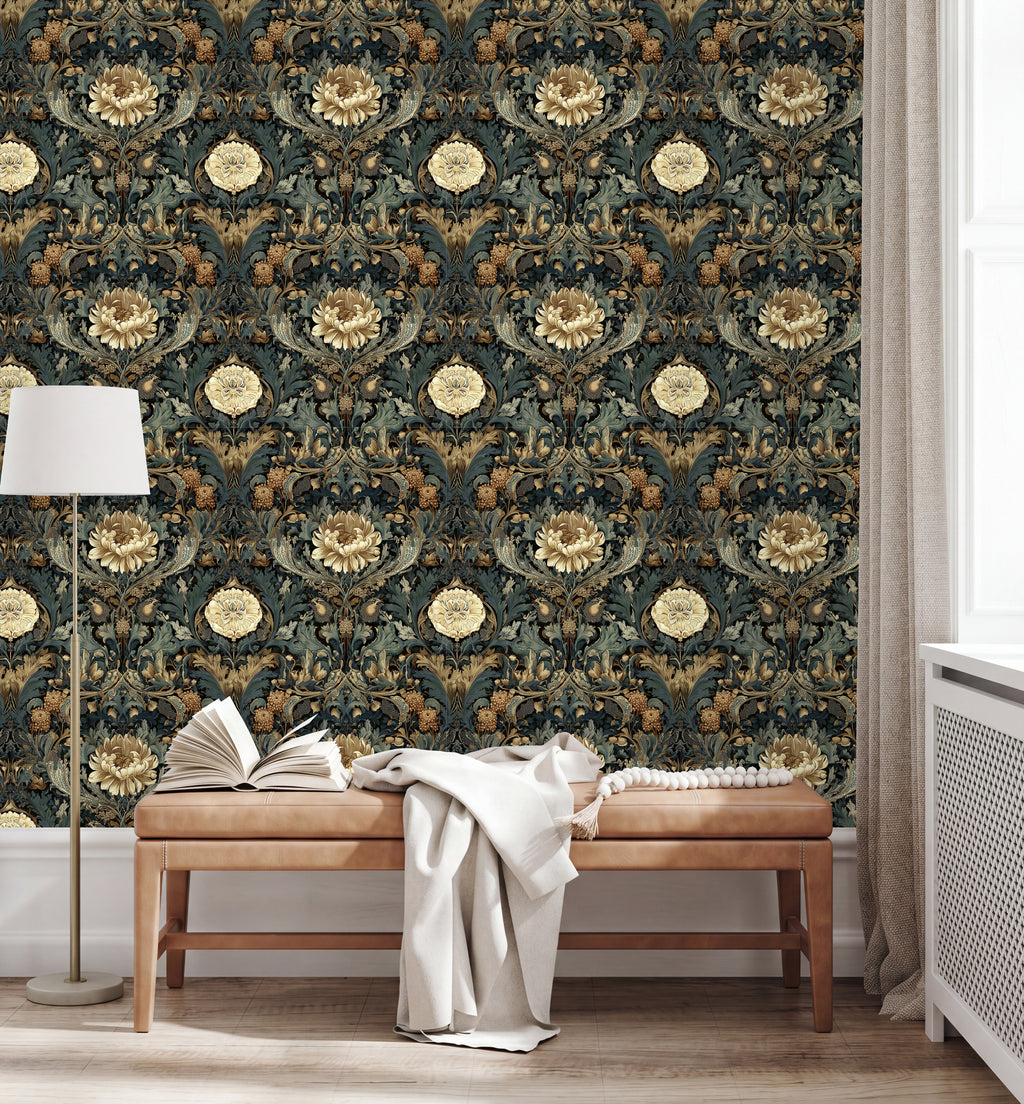 a room with a large, ornate floral wallpaper covering the wall behind a wooden bench. On the bench, there is an open book and a white blanket. A lamp is also present in the room, providing additional lighting.
