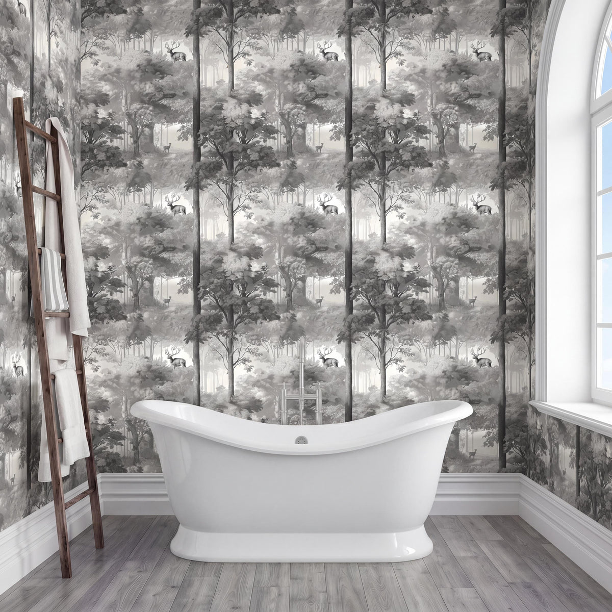 a bathroom with a white freestanding bathtub in the center, surrounded by a forest-themed wallpaper. A wooden ladder is leaning against the wall next to the bathtub.