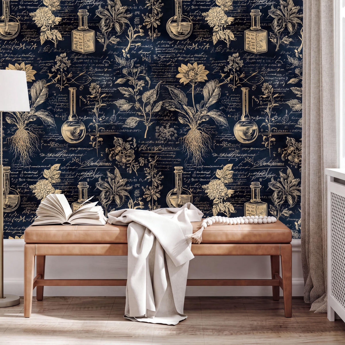 a dark blue wall with gold text and illustrations of various objects, including vases, flowers, and laboratory equipment. In front of the wall, there is a wooden bench with a white blanket draped over it. On the bench, there are two open books and a white cloth.